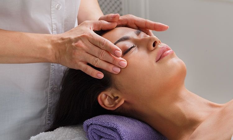 A woman receiving a full body massage in Ernakulam, highlighting the wellness benefits of regular massages for relaxation and health